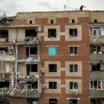 
              Rescue workers inspect an apartments building damaged in an overnight missile strike in Sloviansk, Ukraine, Tuesday, May 31, 2022. (AP Photo/Francisco Seco)
            