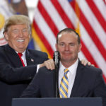 
              FILE - President Donald Trump stands with Sen. Mike Lee, R-Utah, on Dec. 4, 2017, at the Utah State Capitol. Two well-funded challengers will attempt to unseat second-term Lee in Utah's Republican primary in a race that will test whether loyalty to former President Donald Trump remains a litmus test for Republican voters. Lee will appear on the ballot alongside former state lawmaker Becky Edwards and political operative Ally Isom on Tuesday, June 28, 2022. (AP Photo/Rick Bowmer, File)
            