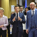 
              European Commission President Ursula von der Leyen, left, French President Emmanuel Macron, center, and European Council President Charles Michel, right, arrive for a round table meeting at an EU summit in Brussels, Thursday, June 23, 2022. European Union leaders are expected to approve Thursday a proposal to grant Ukraine a EU candidate status, a first step on the long toward membership. The stalled enlargement process to include Western Balkans countries in the bloc is also on their agenda at the summit in Brussels. (AP Photo/Geert Vanden Wijngaert)
            