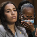 
              Kimberly Salter, wife of Tops Security Guard Aaron Salter, Jr., who died in the Buffalo Tops supermarket mass shooting, cries during a Senate Judiciary Committee hearing on domestic terrorism, Tuesday, June 7, 2022, on Capitol Hill in Washington. (AP Photo/Jacquelyn Martin)
            