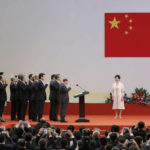 
              FILE - Chinese President Xi Jinping, right, administers the oath to Hong Kong's new Chief Executive Carrie Lam's new cabinet in office at the Hong Kong Convention and Exhibition Center in Hong Kong on July 1, 2017. Xi will visit Hong Kong this week to celebrate the 25th anniversary of the former British colony's 1997 return to China, a state news agency said Saturday, June 25, 2022, in his first trip outside the mainland since the start of the coronavirus pandemic 2 1/2 years ago. (AP Photo/Kin Cheung, File)
            