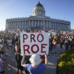
              People attend an abortion-rights protest at the Utah State Capitol in Salt Lake City after the Supreme Court overturned Roe v. Wade, Friday, June 24, 2022. The U.S. Supreme Court's decision to end constitutional protections for abortion has cleared the way for states to impose bans and restrictions on abortion — and will set off a series of legal battles. (AP Photo/Rick Bowmer)
            