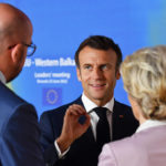 
              European Commission President Ursula von der Leyen, right, speaks with French President Emmanuel Macron, center, and European Council President Charles Michel prior to a group photo with Western Balkan leaders at an EU summit in Brussels, Thursday, June 23, 2022. European Union leaders are expected to approve Thursday a proposal to grant Ukraine a EU candidate status, a first step on the long toward membership. The stalled enlargement process to include Western Balkans countries in the bloc is also on their agenda at the summit in Brussels. (John Thys, Pool Photo via AP)
            