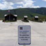 
              FILE - The entrance to Yellowstone National Park, a major tourist attraction, sits closed due to the historic floodwaters on June 15, 2022, in Gardiner, Mont. Created in 1872 as the United States was recovering from the Civil War, Yellowstone was the first of the national parks that have been referred to as America's best idea. Now, the home to soaring geysers and some of the country's most plentiful and diverse wildlife is facing its biggest challenge in decades. (AP Photo/David Goldman, File)
            
