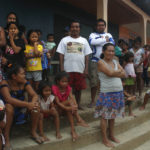 
              Indigenous people watch the police activities during the search for British journalist Dom Phillips and Indigenous affairs expert Bruno Araujo Pereira in the Javari Valley Indigenous territory, in Atalaia do Norte, Amazonas state, Brazil, Saturday, June 11, 2022. According to the police, a wildcat fisherman is the main suspect in the disappearance of Phillips and Pereira and authorities say illegal fishing near the Javari Valley Indigenous Territory, where they went missing last Sunday, has raised the tension with local Indigenous groups in the isolated area near the country's border with Peru and Colombia. (AP Photo/Edmar Barros)
            