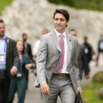 
              Canada's Prime Minister Justin Trudeau, center, walks to a media conference near the G7 venue at Castle Elmau in Kruen, Germany, on Tuesday, June 28, 2022. The Group of Seven leading economic powers are concluding their annual gathering on Tuesday. (AP Photo/Markus Schreiber)
            