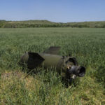 
              The wreckage of a Russian missile lays on a wheat field near Soledar, eastern Ukraine, Monday, June 6, 2022. (AP Photo/Bernat Armangue)
            