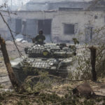 
              FILE - A Ukrainian tank is in position during heavy fighting on the front line in Severodonetsk, the Luhansk region, Ukraine, Wednesday, June 8, 2022. (AP Photo/Oleksandr Ratushniak, File)
            