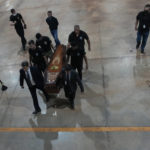 
              Federal police officers arrive with recovered human remains believed to be of the Indigenous expert Bruno Pereira of Brazil and freelance reporter Dom Phillips of Britain, at the Federal Police hangar in Brasília, Brazil, Thursday,, June 16, 2022. A federal police investigator said a suspect confessed to fatally shooting Pereira and Phillips in a remote part of the Amazon and took officers to where the bodies were buried. (AP Photo/Eraldo Peres)
            