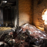 
              FILE - Scattered grain sits inside a warehouse damaged by Russian attacks in Cherkaska Lozova, outskirts of Kharkiv, eastern Ukraine, May 28, 2022. Russia and Turkey voiced support Wednesday, June 8, 2022, for the creation of a safe maritime corridor in the Black Sea so Ukraine can export grain to global markets amid an escalating world food crisis. But Russia demanded that the Black Sea be demined and Turkey said allowing the Ukraine exports should be accompanied by easing Western sanctions against Russia. (AP Photo/Bernat Armangue, File)
            