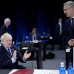 
              British Prime Minister Boris Johnson, left, and NATO Secretary General Jens Stoltenberg during a round table meeting at a NATO summit in Madrid, Spain on Thursday, June 30, 2022. North Atlantic Treaty Organization heads of state will meet for the final day of a NATO summit in Madrid on Thursday. (AP Photo/Bernat Armangue)
            