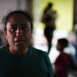 
              FILE - Iracema Figueroa, left, of Honduras, looks on at a shelter for migrants, May 20, 2022, in Tijuana, Mexico. The Supreme Court has ruled that the Biden administration properly ended a Trump-era policy forcing some U.S. asylum-seekers to wait in Mexico. The justices’ 5-4 decision for the administration came in a case about the “Remain in Mexico” policy under President Donald Trump. (AP Photo/Gregory Bull, File)
            