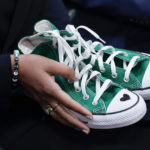 
              Camila Alves McConaughey holds the lime green Converse tennis shoes that were worn by Uvalde shooting victim Maite Yuleana Rodriguez, 10, as Matthew McConaughey, a native of Uvalde, Texas, joins White House press secretary Karine Jean-Pierre for the daily briefing at the White House in Washington, Tuesday, June 7, 2022. (AP Photo/Susan Walsh)
            