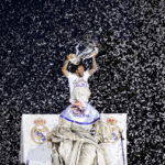 
              Real Madrid player Marcelo holds the trophy at the Cibeles square during a trophy parade in front of the City Hall in Madrid, Spain, Sunday, May 29, 2022. Real Madrid beat Liverpool 1-0 in the Champions League final in Paris. (AP Photo/Andrea Comas)
            