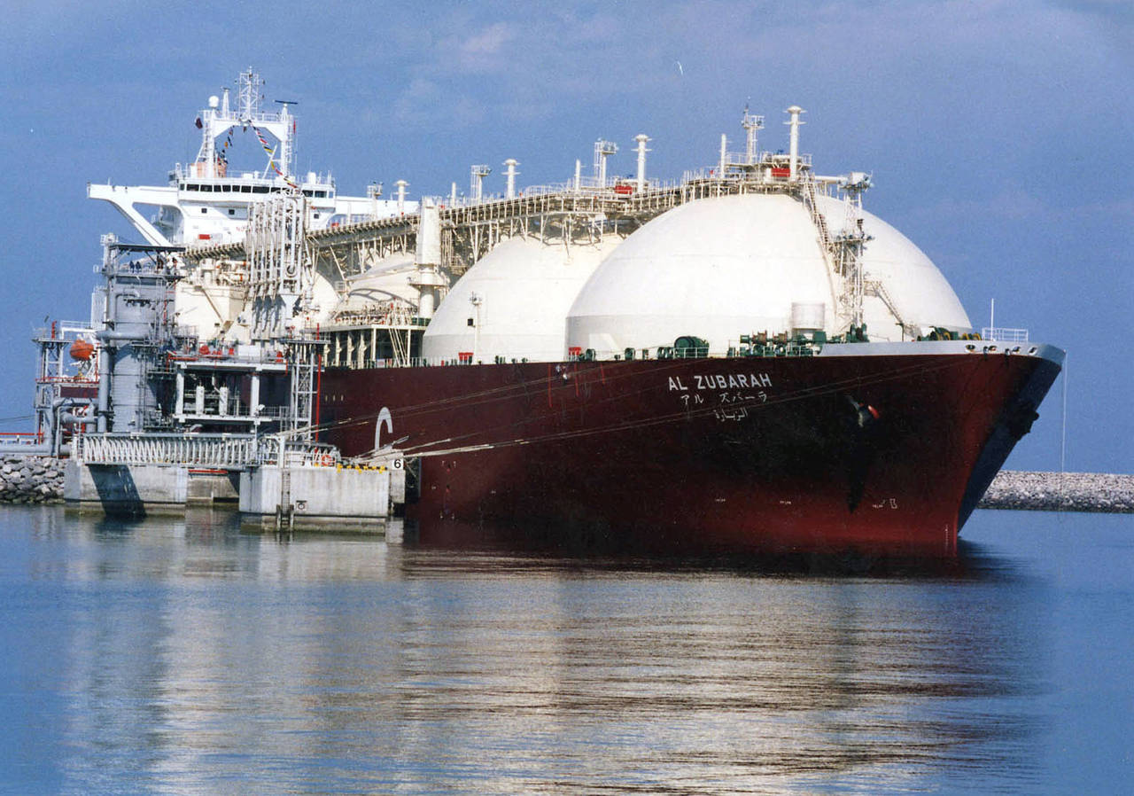FILE - This undated file photo shows a Qatari liquid natural gas (LNG) tanker ship being loaded up ...