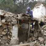 
              An Afghan villager collects his belongings from under the rubble of his home that was destroyed in an earthquake in the Spera District of the southwestern part of Khost Province, Afghanistan, Wednesday, June 22, 2022. A powerful earthquake struck a rugged, mountainous region of eastern Afghanistan early Wednesday, killing at least 1,000 people and injuring 1,500 more in one of the country's deadliest quakes in decades, the state-run news agency reported. (AP Photo)
            