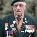 
              British veteran Richard Forrester of the Kings Royal Rifle Corps arrives at the ceremony at Pegasus Bridge, in Ranville, Normandy, Sunday, June, 5, 2022. On Monday, the Normandy American Cemetery and Memorial, home to the gravesites of 9,386 who died fighting on D-Day and in the operations that followed, will host U.S. veterans and thousands of visitors in its first major public ceremony since 2019. (AP Photo/Jeremias Gonzalez)
            