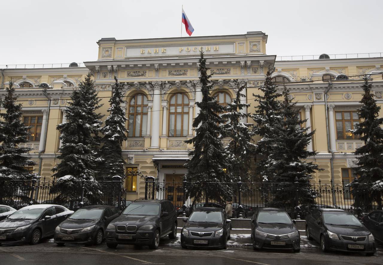 FILE - Cars are parked in front of Russia's Central Bank building in Moscow, Russia, Jan. 30, 2015....