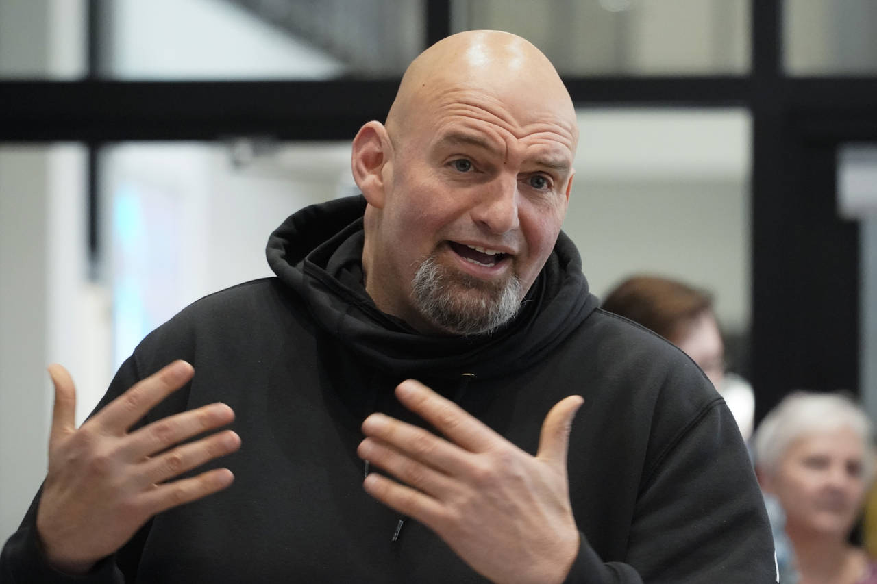 FILE - Pennsylvania Lt. Gov. John Fetterman visits with people attending a Democratic Party event f...