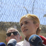 
              Cyprus Prisons Director Anna Aristotelous speaks to the media after formally filing a complaint against a senior police officer she accused of tasking an inmate to gather any information or video about her private life that could be used to blackmail her, on Monday, June 20, 2022. Cyprus' attorney-general has appointed a criminal investigator to probe the allegations. (AP Photo/Philippos Christou)
            
