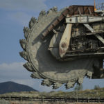 
              A worker at Public Power Company (PPC) stands at a coal excavator at Greece's largest mine outside the northern city of Kozani on Thursday, June 2, 2022. Energy market turmoil caused by the war in Ukraine has triggered an increase in coal-fired electricity production in the European Union and a temporary slowdown in the closure of power plants long-earmarked for retirement. (AP Photo/Thanassis Stavrakis)
            