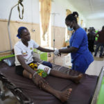 
              A victim of St. Francis Catholic Church attack receives treatment at St Louis Catholic Hospital in Owo, Nigeria, Monday, June 6, 2022. Lawmakers in southwestern Nigeria say more than 50 people are feared dead after gunmen opened fire and detonated explosives at a church. Ogunmolasuyi Oluwole with the Ondo State House of Assembly said the gunmen targeted the St Francis Catholic Church in Ondo state on Sunday morning just as the worshippers gathered for the weekly Mass. (AP Photo/Sunday Alamba)
            