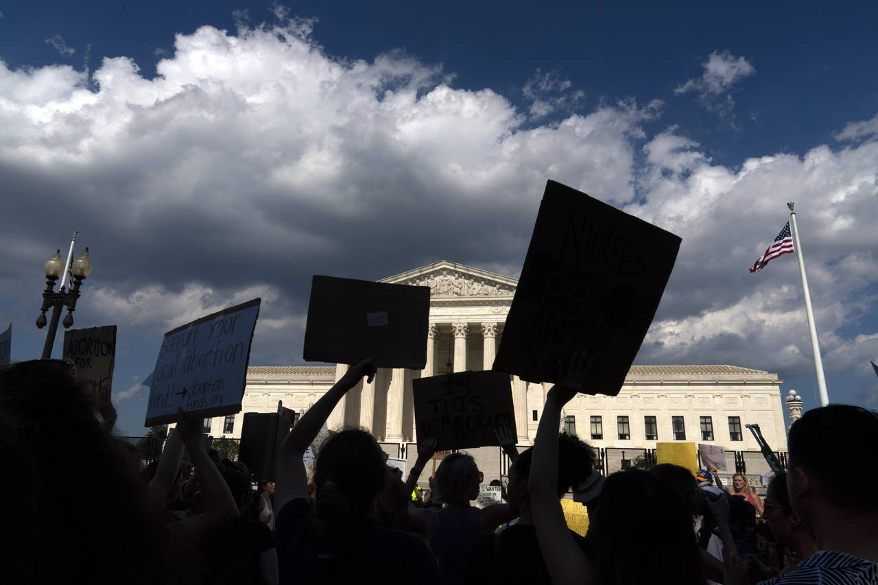 FILE - Abortion-rights activists protest outside the Supreme Court in Washington, Saturday, June 25...