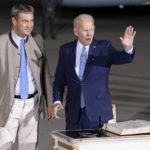
              U.S. President Joe Biden, right, waves next to Bavarian Prime Minister Markus Soeder, after arriving at Franz-Josef-Strauss Airport near Munich, Germany, Saturday, June 25, 2022, ahead of the G7 summit. Biden is in Germany to attend a Group of Seven summit of leaders of the world's major industrialized nations. (Daniel Karmann/dpa via AP)
            