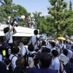 
              Plaintiffs and their supporters gather after hearing the decision of the Tokyo Supreme Court, Friday, June 17, 2022, in Tokyo. Japan’s top court on Friday ruled that the government was not liable for the 2011 Fukushima nuclear crisis, dismissing thousands of evacuees's demands that the state, not just the utility, should pay compensation for the damages inflicted to their lives. (AP Photo/Eugene Hoshiko)
            