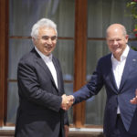 
              German Chancellor Olaf Scholz, right, greets International Energy Agency Executive Director Fatih Birol during the official welcome ceremony of G7 leaders and Outreach guests at Castle Elmau in Kruen, near Garmisch-Partenkirchen, Germany, on Monday, June 27, 2022. The Group of Seven leading economic powers are meeting in Germany for their annual gathering Sunday through Tuesday. (AP Photo/Matthias Schrader)
            