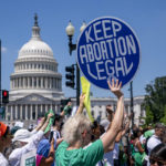 
              Abortion-rights activists demonstrate against the Supreme Court decision to overturn Roe v. Wade that established a constitutional right to abortion, on Capitol Hill in Washington, Thursday, June 30, 2022. (AP Photo/J. Scott Applewhite)
            