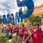 
              Gun control advocates protest in Christopher Columbus Park, Saturday, June 11, 2022, in Boston. Thousands of people are rallying across the country in a renewed push for gun control measures after recent deadly mass shootings. (AP Photo/Michael Dwyer)
            