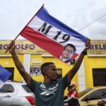 
              A supporter celebrates after former leftist rebel Gustavo Petro won a runoff presidential election in Cali, Colombia, Sunday, June 19, 2022. (AP Photo/Andres Quintero)
            