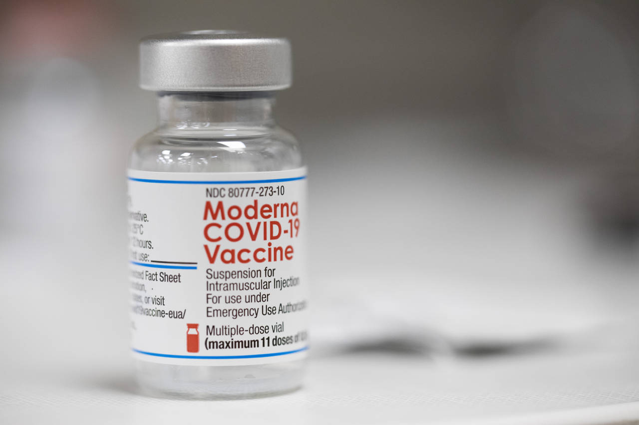 FILE - A vial of the Moderna COVID-19 vaccine is displayed on a counter at a pharmacy in Portland, ...
