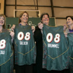 
              FILE - New Seattle Storm owners Dawn Trudeau, Ginny Gilder, Lisa Brummel and Anne Levinson, from left, hold team jerseys with their names as they pose following a news conference announcing the planned purchase Tuesday, Jan. 8, 2008, in Seattle. As Title IX marks its 50th anniversary this year, Gilder is one of countless women who benefited from the enactment and execution of the law, translating those opportunities into becoming leaders in their professional careers. (AP Photo/Elaine Thompson, FIle)
            