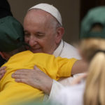 
              Pope Francis hugs a child refugee from Ukraine during an audience in the San Damaso courtyard at the Vatican, Saturday, June 4, 2022. Pope Francis met about 160 children of the Sant'Alessio- Margherita di Savoia care institution for blind, visually impaired, or with other disabilities and a group of children refugee from Ukraine. (AP Photo/Alessandra Tarantino)
            