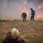 
              Firefighters work during a wildfire in Arraiza, northern Spain, Saturday, June 18, 2022. Firefighters in Spain are struggling to contain wildfires in several parts of the country suffering an unusual heat wave for this time of the year. (AP Photo/Sergio Martin)
            