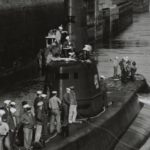 Navy submarine USS Volador makes its way through the Ballard Locks to take part in "Operation Seafair" training exercise at the old Sand Point Naval Air Station in August 1952. (US Navy Naval History and Heritage Command)
