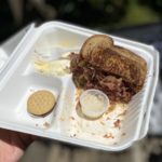 The Market House Corned Beef Reuben sandwich is huge - that's half a sandwich in the photo - and it comes with potato salad, pickle spear, horseradish and a cookie. (Feliks Banel/KIRO Newsradio)