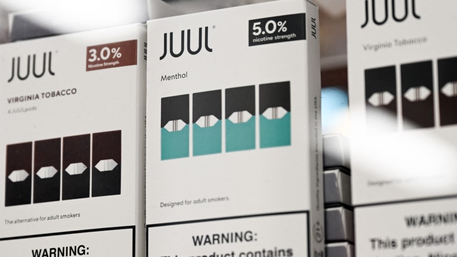 JUUL Labs Inc. Virginia tobacco and menthol flavored vaping e-cigarette products are displayed in a...