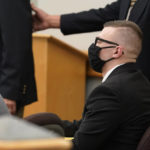 
              Volodymr Zhukovskyy, of West Springfield, Mass., charged with negligent homicide in the deaths of seven motorcycle club members in a 2019 crash, is seated in a courtroom at Coos County Superior Court in Lancaster, N.H., Tuesday, July 26, 2022, before opening statements in his trial. Zhukovskyy has pleaded not guilty to multiple counts of negligent homicide, manslaughter, reckless conduct and driving under the influence in the June 21, 2019, crash. (AP Photo/Steven Senne, Pool)
            