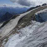 
              A view taken from a rescue helicopter of the Punta Rocca glacier near Canazei, in the Italian Alps in northern Italy, Tuesday, July 5, 2022, two days after a huge chunk of the glacier broke loose, sending an avalanche of ice, snow, and rocks onto hikers. Italy was enduring a prolonged heat wave before a massive piece of the Alpine glacier broke off and killed hikers on Sunday and experts say climate change will make those hot, destabilizing conditions more common.  (AP Photo/Luca Bruno)
            