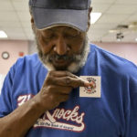 
              Kenneth Blackwell Sr of Randallstown places his "I Voted " sticker on his shirt after casting his ballot at Randallstown Community Center during Maryland's primary election, Tuesday, July 19, 2022, in Randallstown, Md. (Barbara Haddock Taylor/The Baltimore Sun via AP)
            