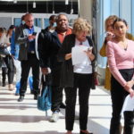 
              FILE - Applicants line up at a job fair at the Ocean Casino Resort in Atlantic City N.J., on April 11, 2022. Applications for jobless aid for the week ending July 9 rose by 9,000 to 244,000, up from the previous week's 235,000, the Labor Department reported Thursday, July 14, 2022. First-time applications generally reflect layoffs. Analysts had expected the number to remain flat from the previous week. (AP Photo/Wayne Parry, File)
            