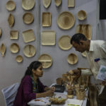 
              A visitor makes enquiries about eco-friendly cutlery items at an event to create awareness about eco-friendly products in New Delhi, India, Friday, July 1, 2022. India banned some single-use or disposable plastic products Friday as part of a federal plan to phase out the ubiquitous material in the nation of nearly 1.4 billion people. (AP Photo/Altaf Qadri)
            