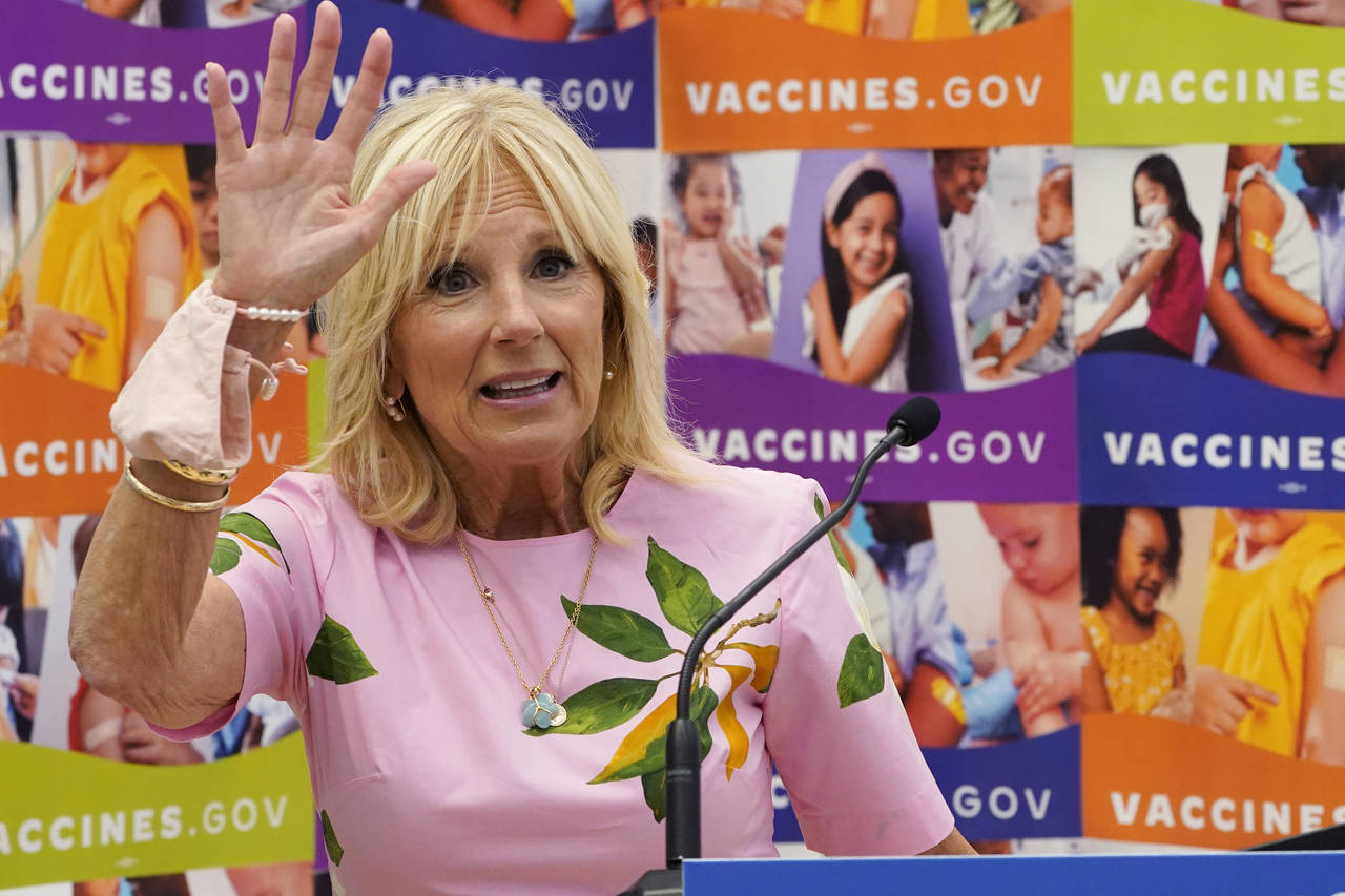FILE - First lady Jill Biden waves as she speaks during a tour of a health facility, July 1, 2022, ...