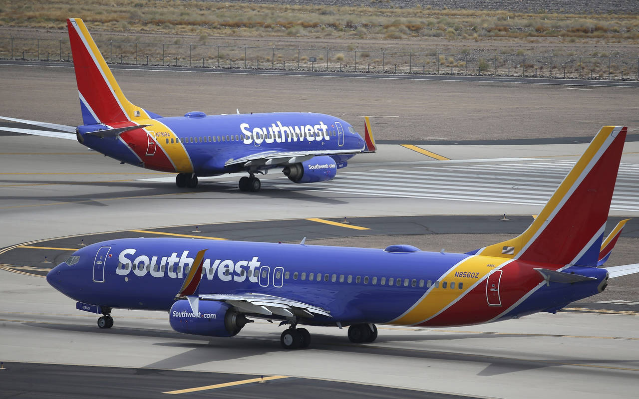 FILE - Southwest Airlines planes at Phoenix Sky Harbor International Airport in Phoenix, July 17, 2...