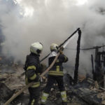 
              In this photo provided by the Luhansk region military administration, Ukrainian firefighters work to extinguish a fire at damaged residential building in Lysychansk, Luhansk region, Ukraine, early Sunday, July 3, 2022. Russian forces pounded the city of Lysychansk and its surroundings in an all-out attempt to seize the last stronghold of resistance in eastern Ukraine's Luhansk province, the governor said Saturday. A presidential adviser said its fate would be decided within the next two days. (Luhansk region military administration via AP)
            