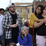 Residents from around the Highland Park, Ill., area listen during a vigil in Highwood, Ill., for the victims of Monday's Highland Park Fourth of July parade mass shooting, Wednesday, July 6, 2022. (AP Photo/Charles Rex Arbogast)