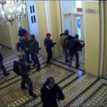 
              This exhibit from video released by the House Select Committee, shows security video of rioters entering the Capitol on Jan. 6, displayed at a hearing by the House select committee investigating the Jan. 6 attack on the U.S. Capitol, Thursday, July 21, 2022, on Capitol Hill in Washington. (House Select Committee via AP)
            